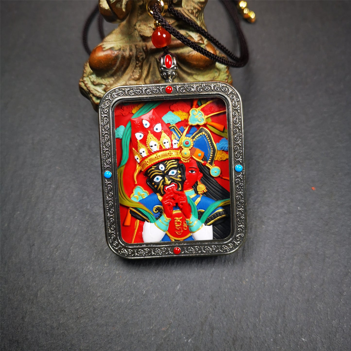 This Drashi Lhamo Gau box is made by Tibetan craftsmen in Hepo Township, Baiyu County,filled in a unique fashion Drashi Lhamo Tsa Tsa - Tibetan girl wearing her mask,made of pottery clay,hand painted.