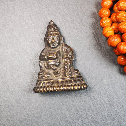 This Yellow Jambhala(Dzambhala) statue was collected from Goinqên goinba Monastery,Dege Tibet,handmade thokcha pendant 80 years ago. It's made of brass,brown color,1.97 inches height and 1.38 inches width.