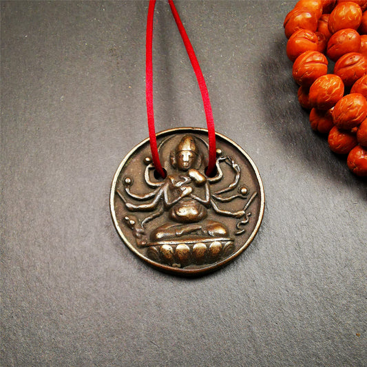 This Usnisa Vijaya statue was collected from Derge,Tibet. It's a badge or pendant,made of copper,brown color, 1.4 inch diameter. You can make it into a necklace,or bag hanging,or just put into your shrine.