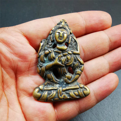 This Vajrasattva statue was collected from Derge,Tibet. It's a badge or pendant,made of copper,brown color, size is 2.24" × 1.57". You can make it into a necklace,or bag hanging
