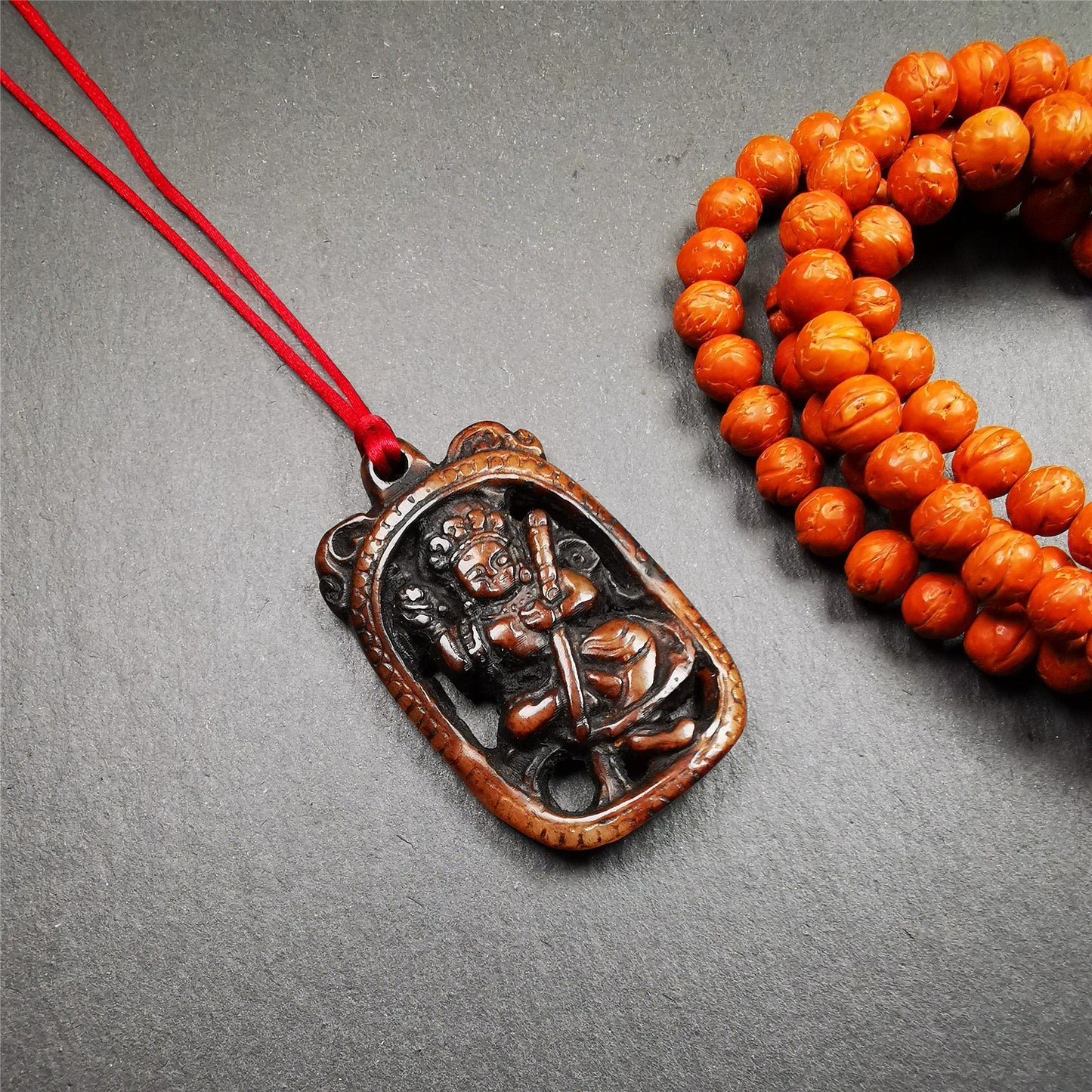 This Troma Nagmo amulet was collected from Gerze Tibet, hand carved by Tibetan Craft man. It is made of yak bone,brown color,size is 2.16" × 1.3". You can make it necklace,or just put into your shrine. Troma Nagmo literally means the Black Wrathful Lady. She is included in the Dharmapala pantheon as a form of Vajravarahi. She is also the feminine embodiment of w