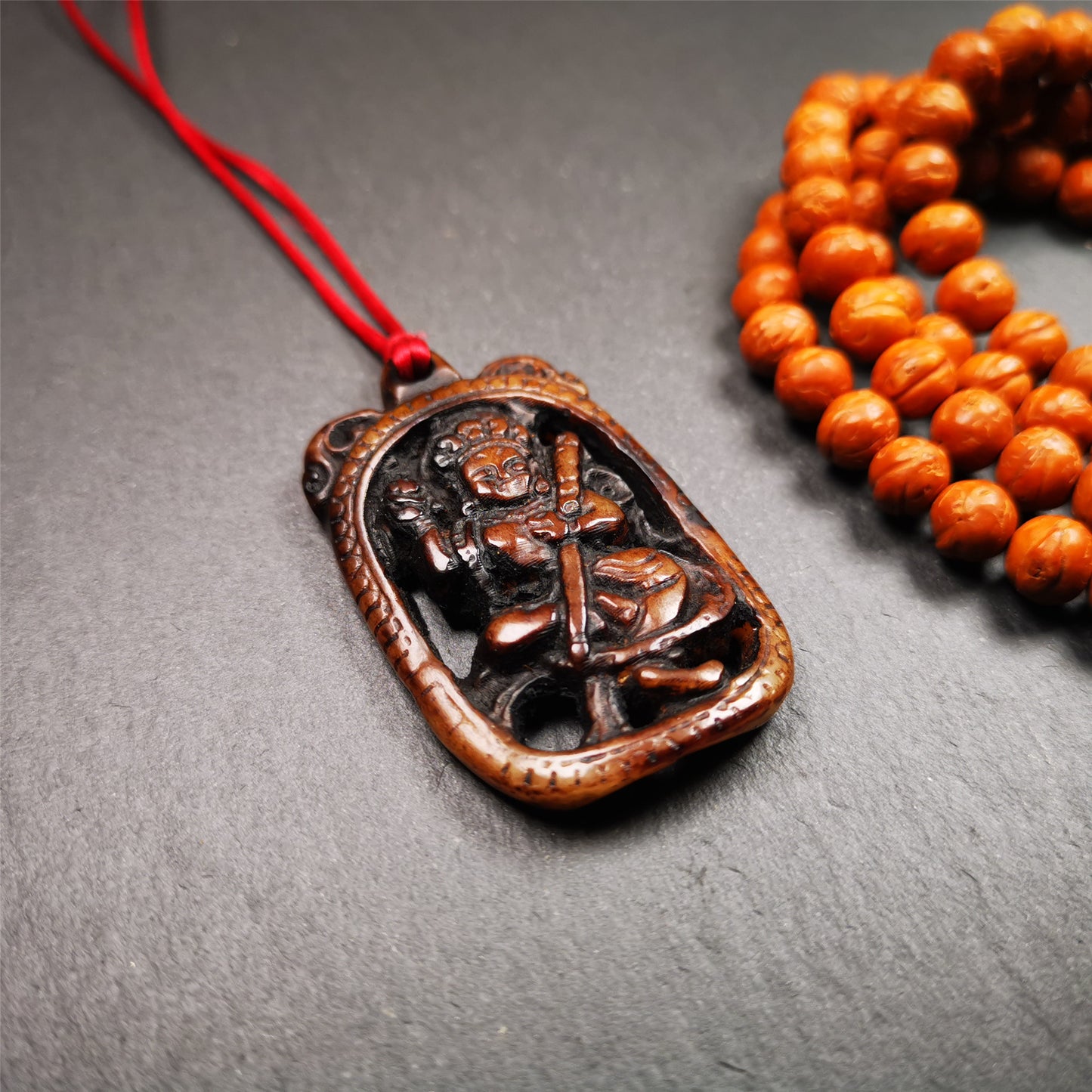 This Troma Nagmo amulet was collected from Gerze Tibet, hand carved by Tibetan Craft man. It is made of yak bone,brown color,size is 2.16" × 1.3". You can make it necklace,or just put into your shrine. Troma Nagmo literally means the Black Wrathful Lady. She is included in the Dharmapala pantheon as a form of Vajravarahi. She is also the feminine embodiment of w