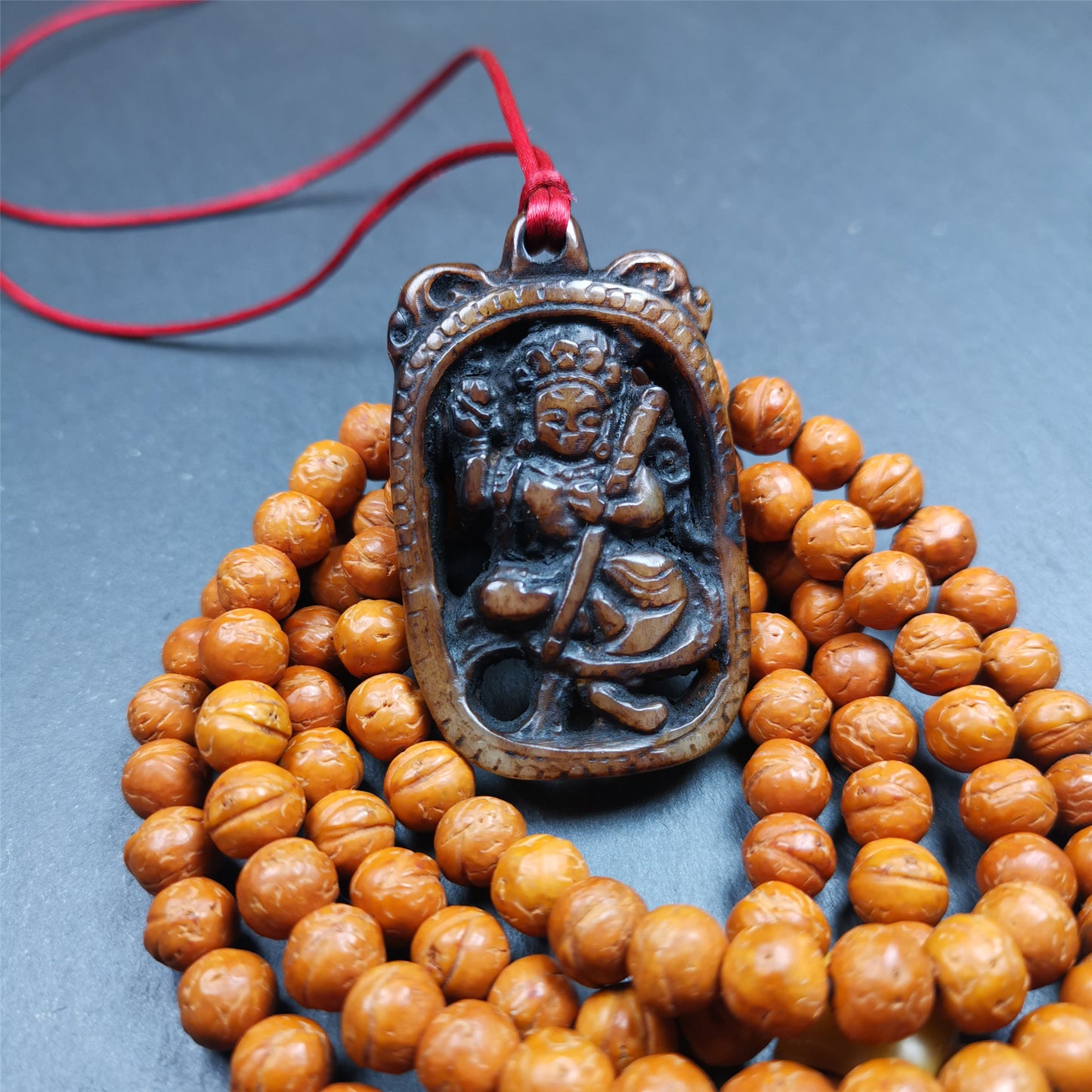 This Troma Nagmo amulet was collected from Gerze Tibet, hand carved by Tibetan Craft man. It is made of yak bone,brown color,size is 2.16" × 1.3". You can make it necklace,or just put into your shrine. Troma Nagmo literally means the Black Wrathful Lady. She is included in the Dharmapala pantheon as a form of Vajravarahi. She is also the feminine embodiment of w