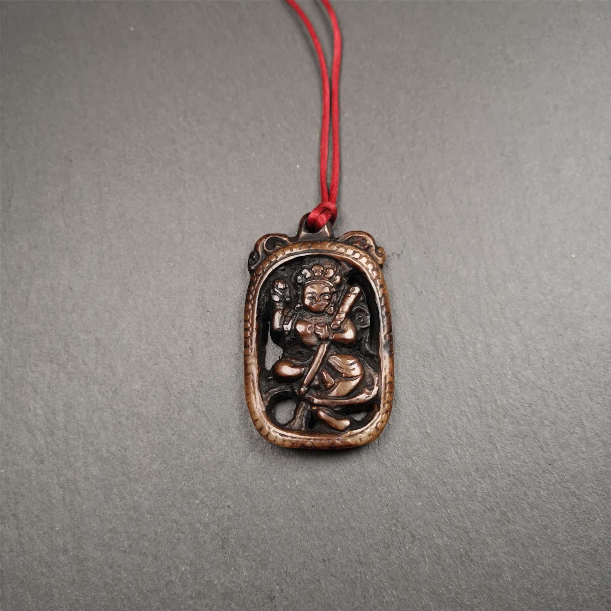 This Troma Nagmo amulet was collected from Gerze Tibet, hand carved by Tibetan Craft man. It is made of yak bone,brown color,size is 2.16" × 1.3". You can make it necklace,or just put into your shrine. Troma Nagmo literally means the Black Wrathful Lady. She is included in the Dharmapala pantheon as a form of Vajravarahi. She is also the feminine embodiment of w