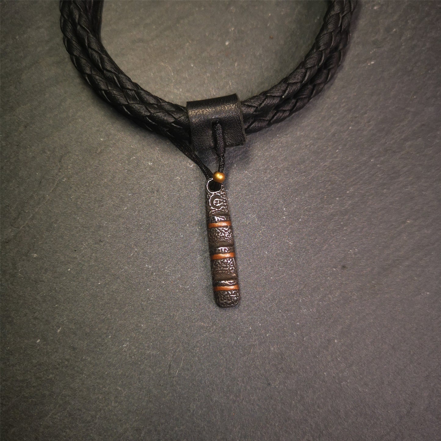This unique Ladder pendant is made by Tibetan craftsmen in Hepo Township, Baiyu County. It is made of cold iron and copper, black color,the shape is Tibetan Ladder of Heaven,length is 32mm. You can make it into a pendant,keychain, or just put it on your desk,as an ornam