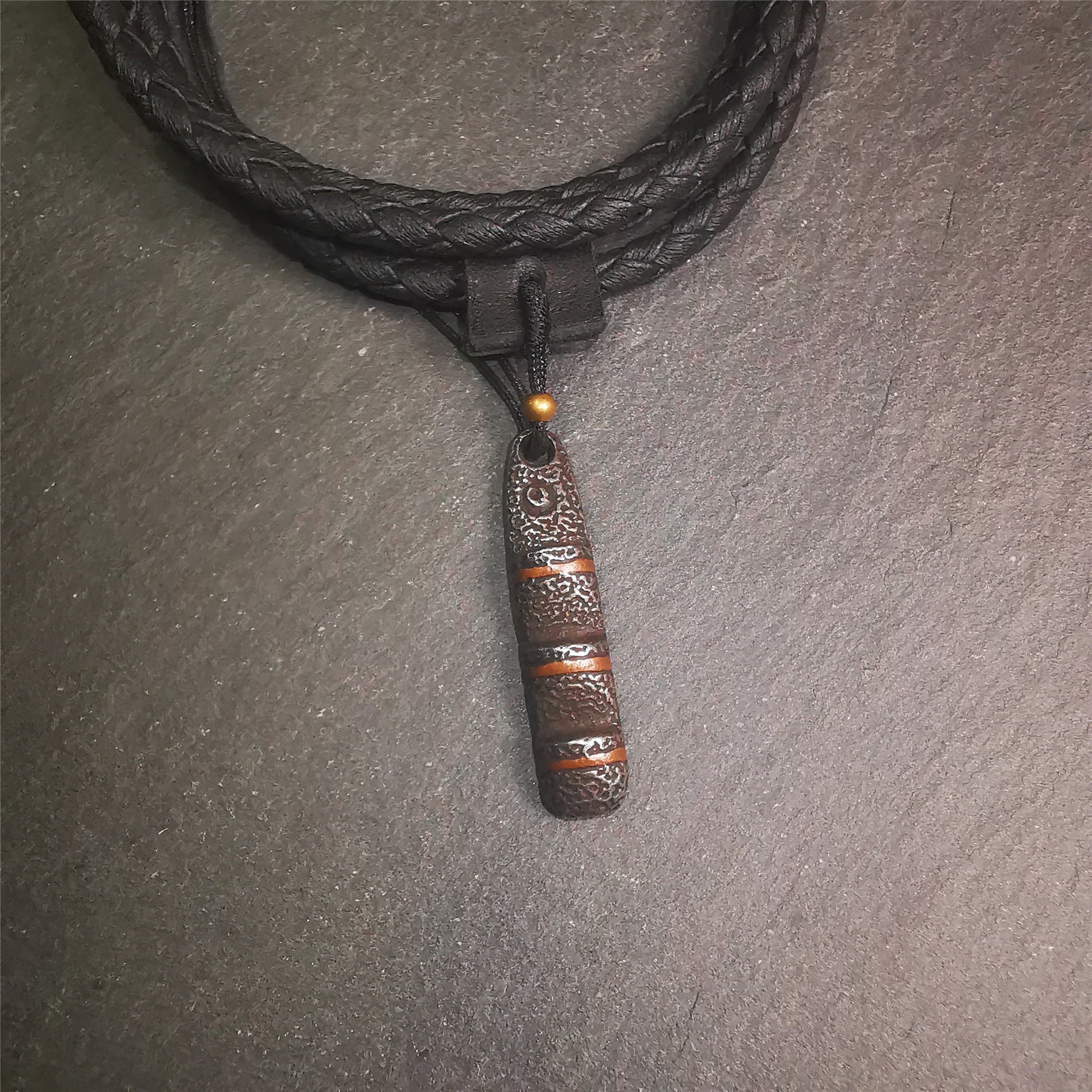 This unique Ladder pendant is made by Tibetan craftsmen. It is made of cold iron and copper, black color,the shape is Tibetan Ladder of Heaven,length is 32mm. You can make it into a pendant,keychain, or just put it on your desk,as an ornament.