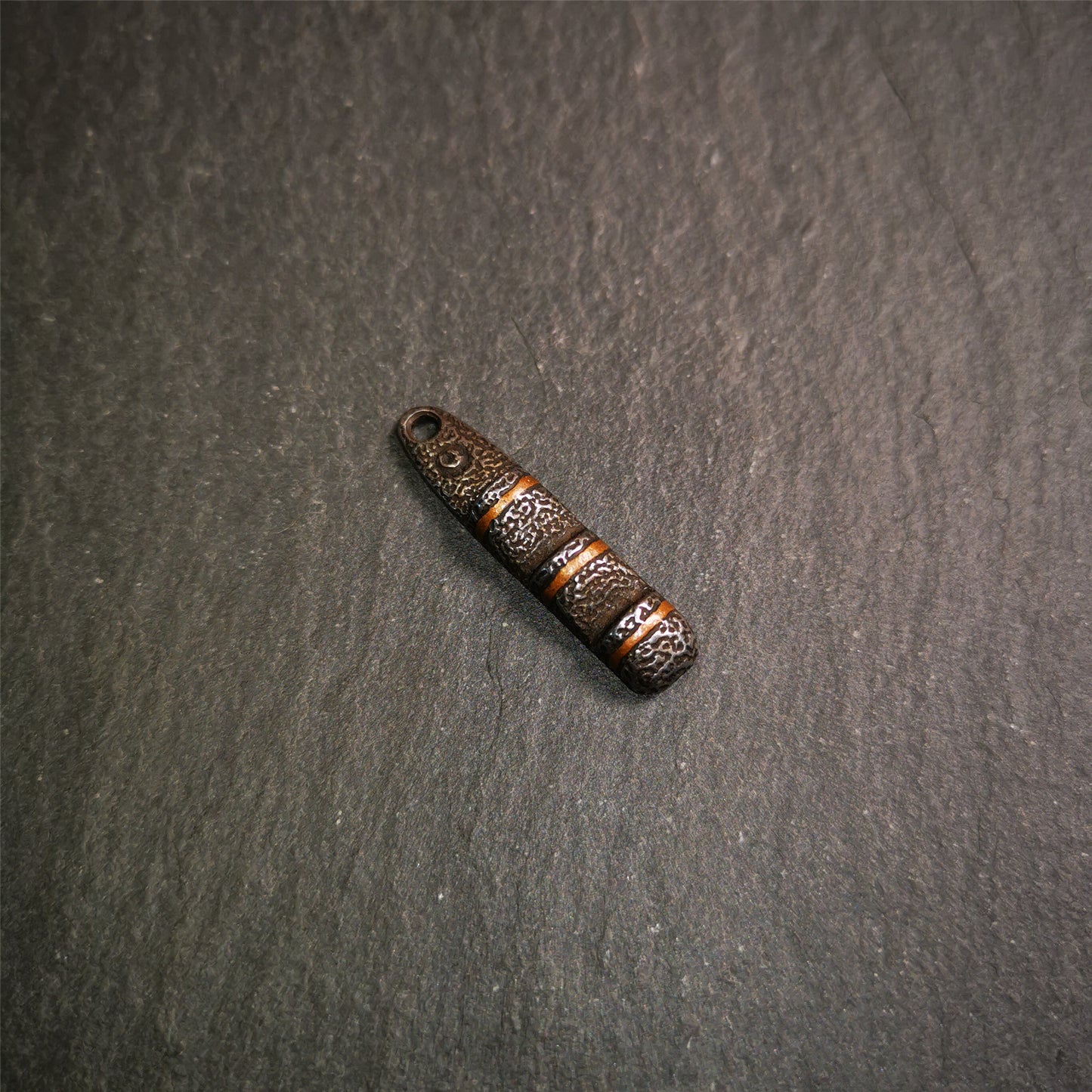This unique Ladder pendant is made by Tibetan craftsmen. It is made of cold iron and copper, black color,the shape is Tibetan Ladder of Heaven,length is 32mm. You can make it into a pendant,keychain, or just put it on your desk,as an ornament.