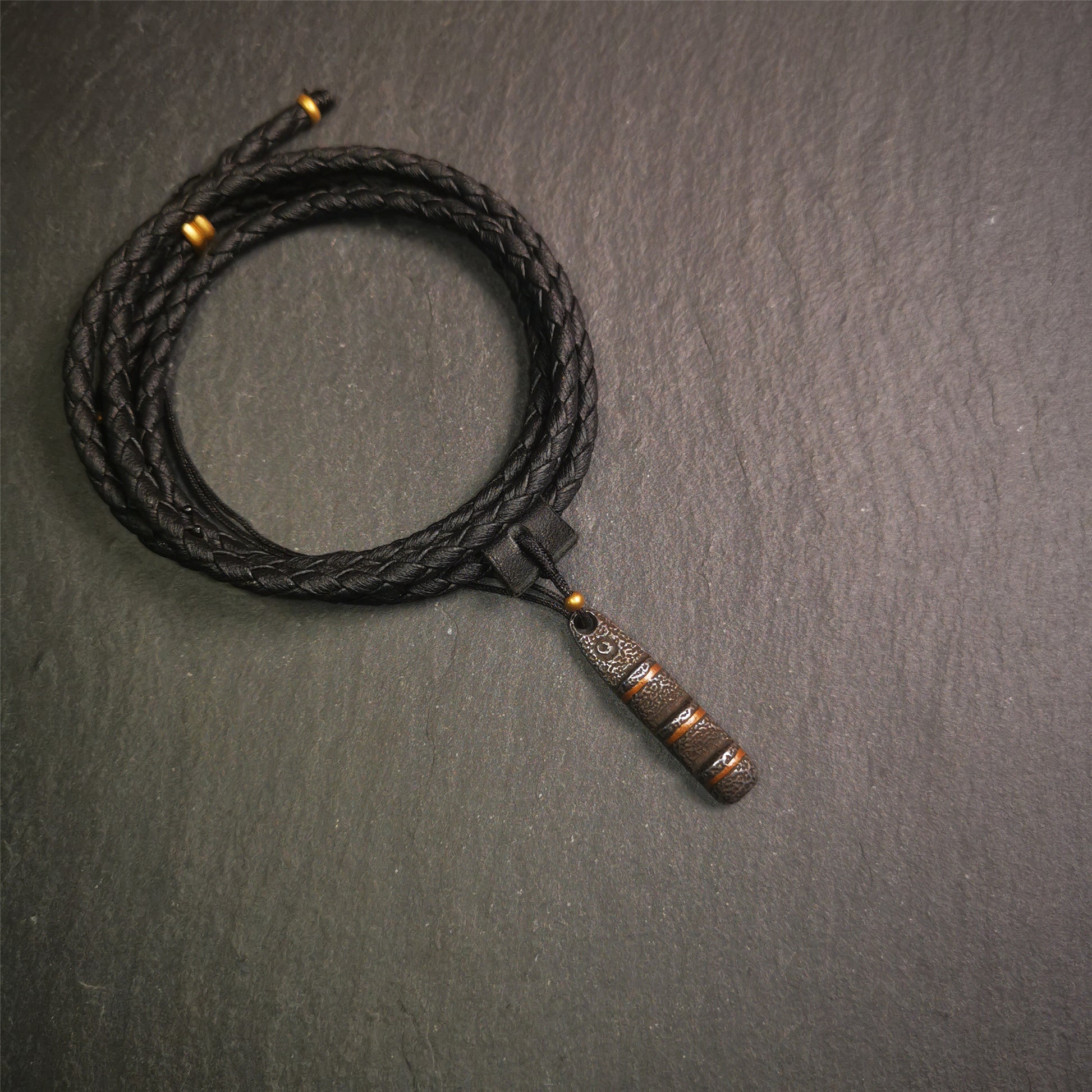 This unique Ladder pendant is made by Tibetan craftsmen. It is made of cold iron and copper, black color,the shape is Tibetan Ladder of Heaven,length is 32mm. You can make it into a pendant,keychain, or just put it on your desk,as an ornament.