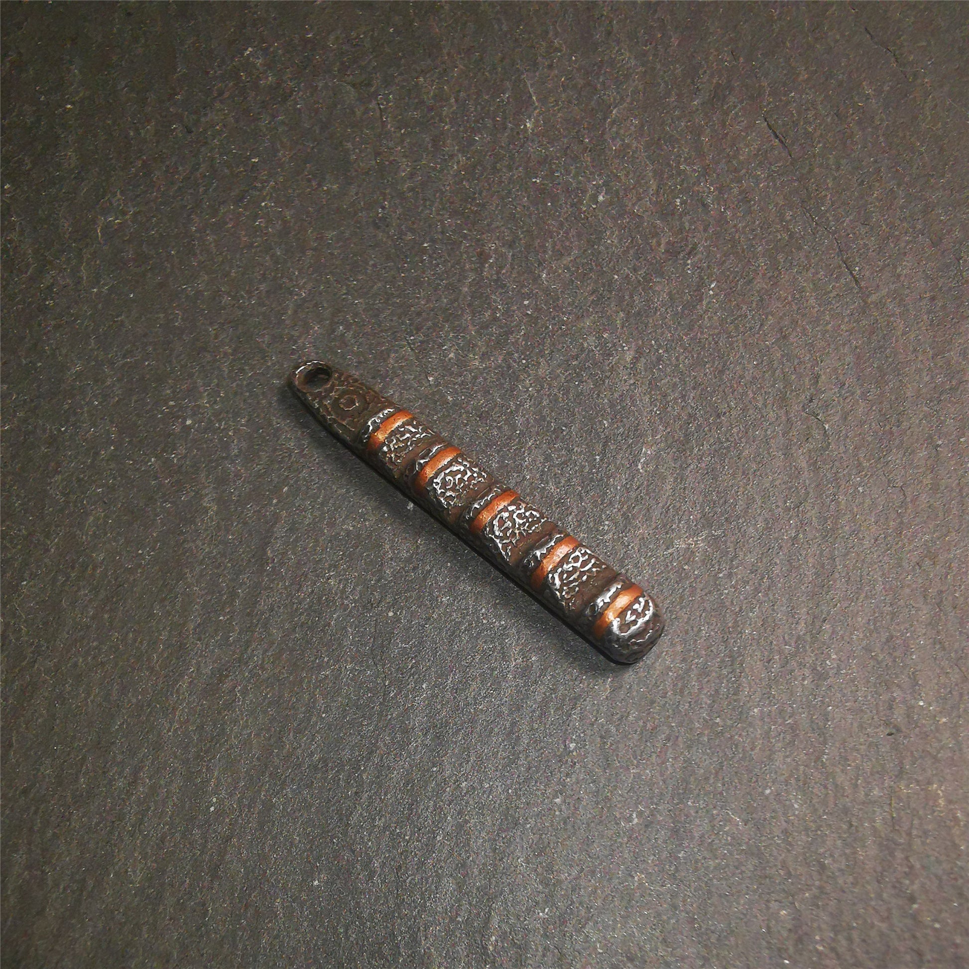 This unique Ladder pendant is made by Tibetan craftsmen. It is made of cold iron and copper, black color,the shape is Tibetan Ladder of Heaven,length is 45mm. You can make it into a pendant,keychain, or just put it on your desk,as an ornament.