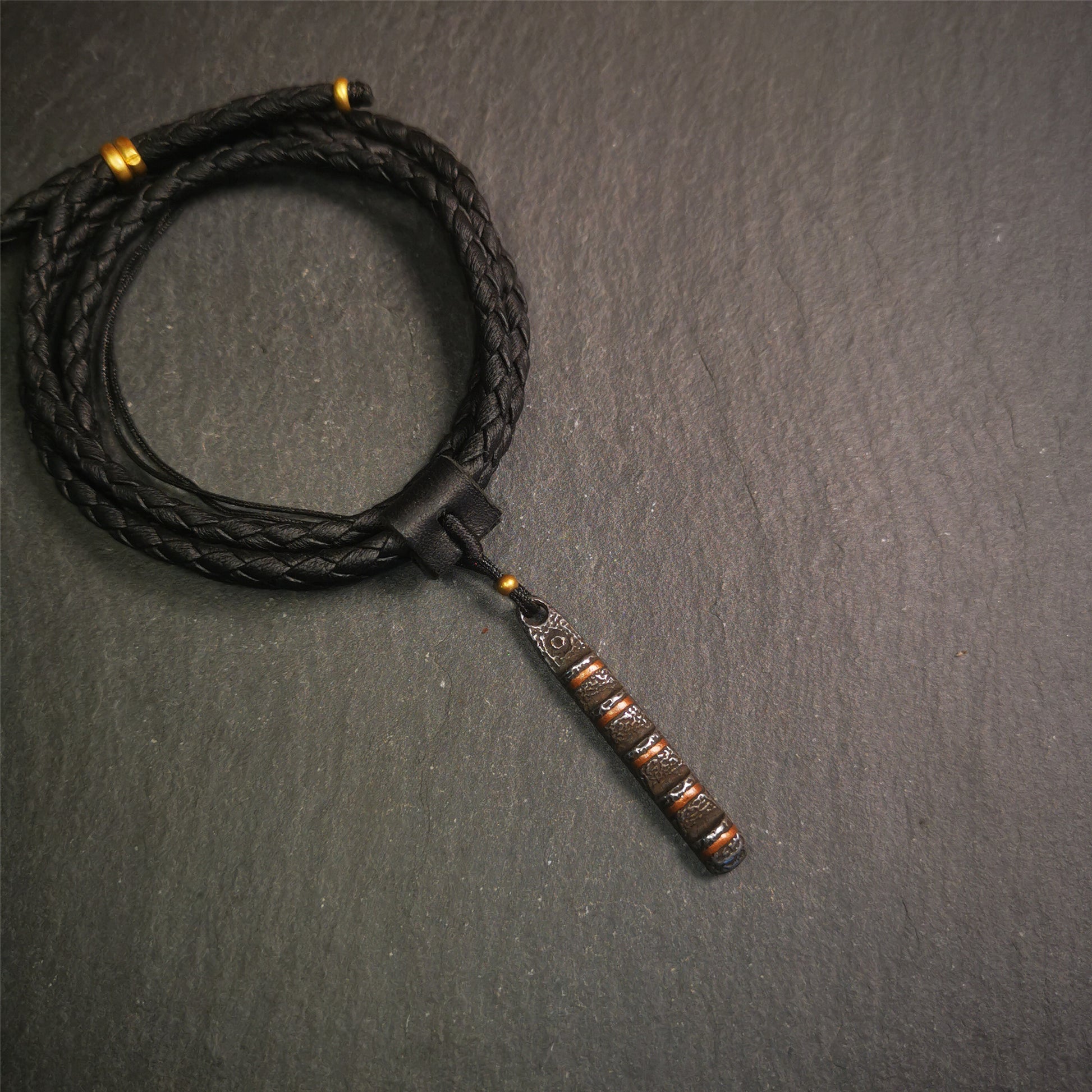 This unique Ladder pendant is made by Tibetan craftsmen. It is made of cold iron and copper, black color,the shape is Tibetan Ladder of Heaven,length is 45mm. You can make it into a pendant,keychain, or just put it on your desk,as an ornament.
