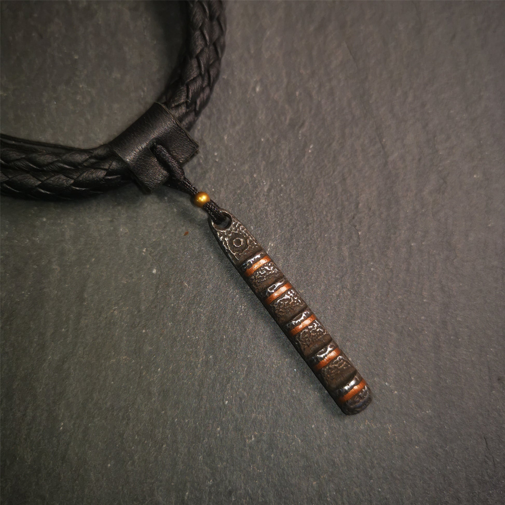 This unique Ladder pendant is made by Tibetan craftsmen. It is made of cold iron and copper, black color,the shape is Tibetan Ladder of Heaven,length is 45mm. You can make it into a pendant,keychain, or just put it on your desk,as an ornament.