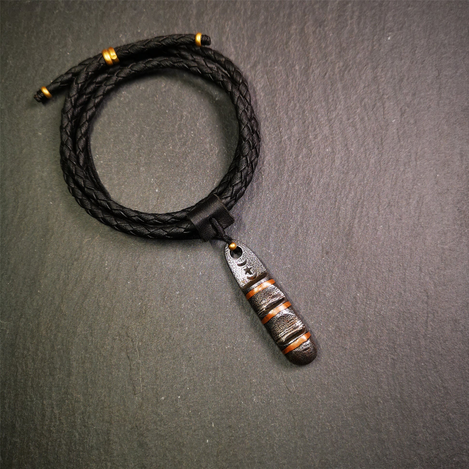 This unique Ladder pendant is made by Tibetan craftsmen. It is made of cold iron and copper, black color,the shape is Tibetan Ladder of Heaven,length is 46mm. You can make it into a pendant,keychain, or just put it on your desk,as an ornament.