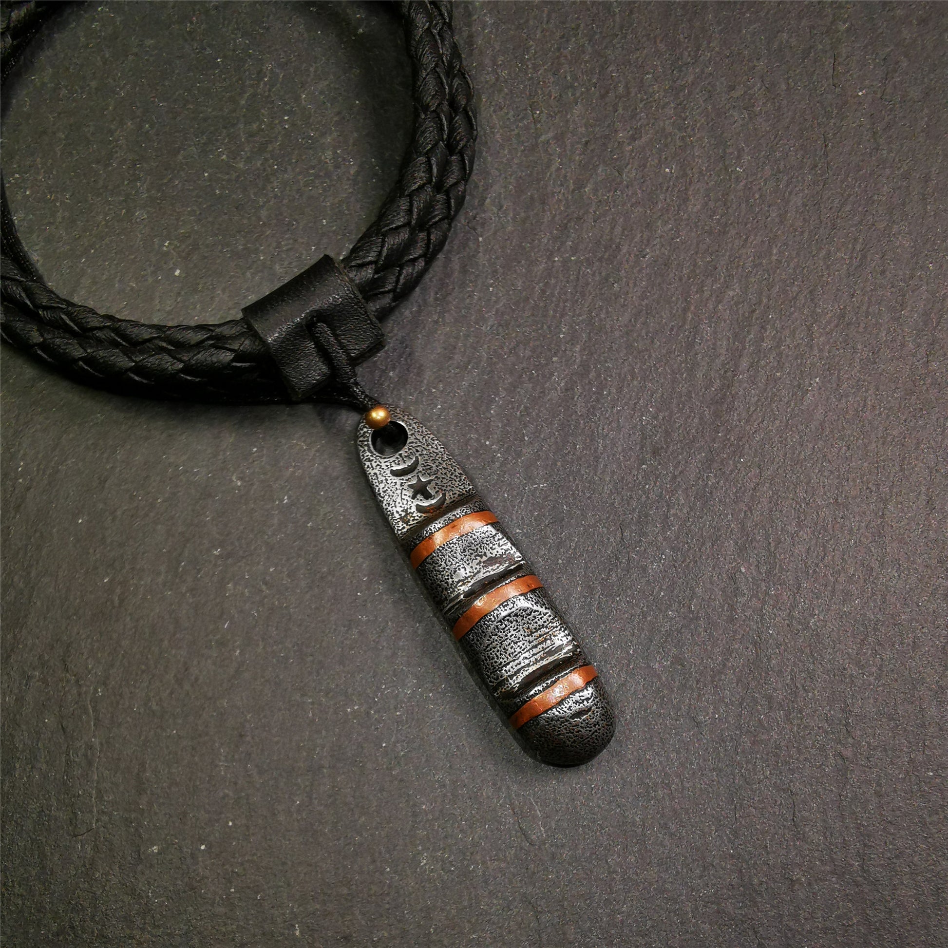 This unique Ladder pendant is made by Tibetan craftsmen. It is made of cold iron and copper, black color,the shape is Tibetan Ladder of Heaven,length is 46mm. You can make it into a pendant,keychain, or just put it on your desk,as an ornament.