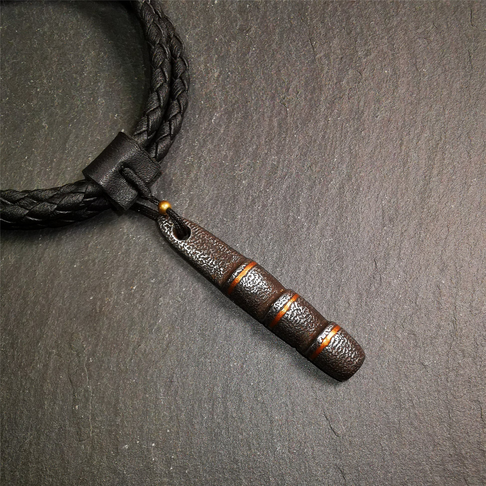This unique Ladder pendant is made by Tibetan craftsmen. It is made of cold iron and copper, black color,the shape is Tibetan Ladder of Heaven,length is 53mm. You can make it into a pendant,keychain, or just put it on your desk,as an ornament.