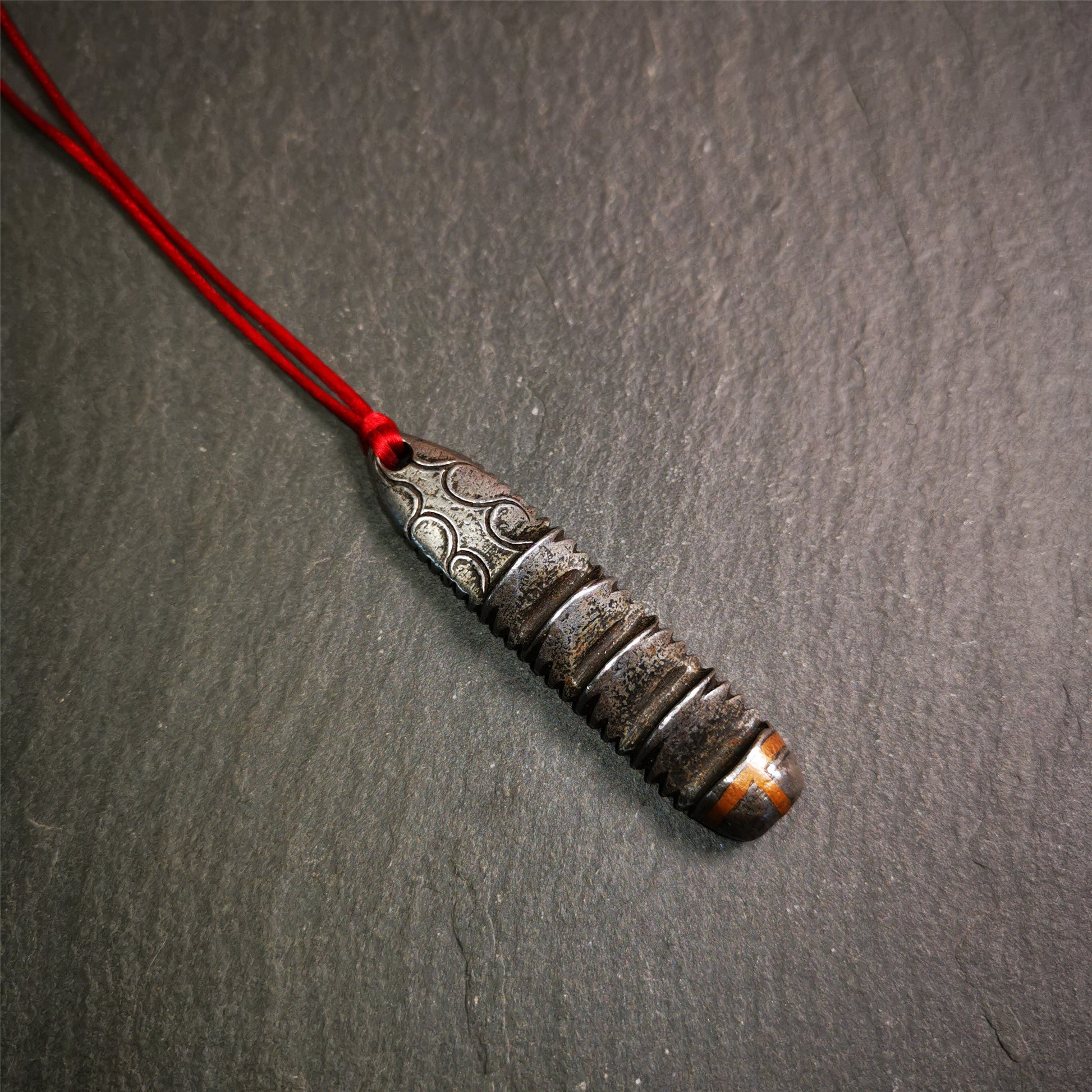 This unique Ladder pendant is made by Tibetan craftsmen in Hepo Township, Baiyu County. It is made of cold iron and copper, black color,the shape is Tibetan Ladder of Heaven,length is 60mm. You can make it into a pendant,keychain, or just put it on your desk,as an ornament.