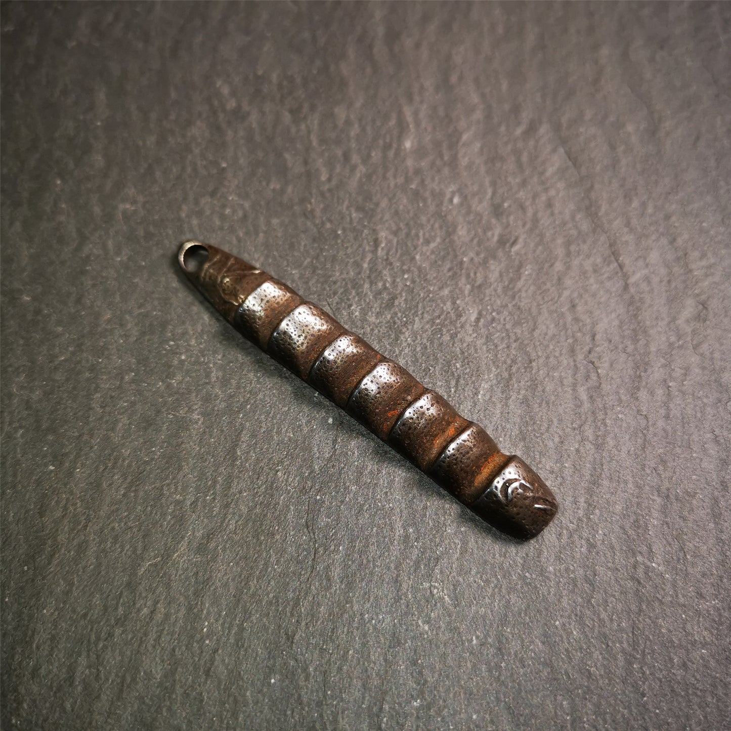 This unique Ladder pendant is made by Tibetan craftsmen. It is made of cold iron and copper, black color,the shape is Tibetan Ladder of Heaven,length is 66mm. You can make it into a pendant,keychain, or just put it on your desk,as an ornament.