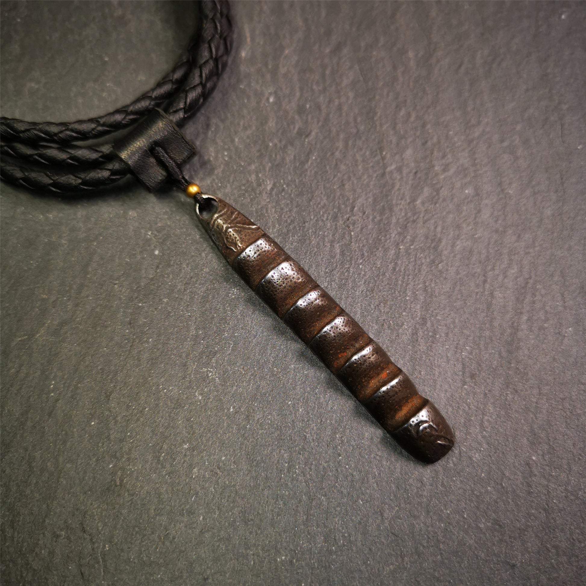 This unique Ladder pendant is made by Tibetan craftsmen. It is made of cold iron and copper, black color,the shape is Tibetan Ladder of Heaven,length is 66mm. You can make it into a pendant,keychain, or just put it on your desk,as an ornament.