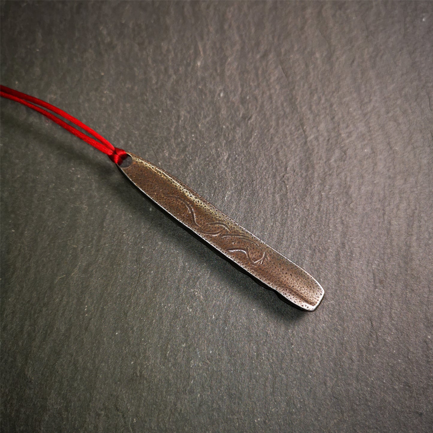 This unique Ladder pendant is made by Tibetan craftsmen. It is made of cold iron and copper, black color,the shape is Tibetan Ladder of Heaven,length is 66mm. You can make it into a pendant,keychain, or just put it on your desk,as an ornament.