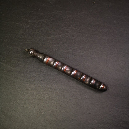 This unique Ladder pendant is made by Tibetan craftsmen in Hepo Township, Baiyu County. It is made of cold iron and copper, black color,the shape is Tibetan Ladder of Heaven,a skull on the top,length is 11cm / 4.33 inches.  The ladder of heaven represents that Tibetans can pass their wishes and blessings to their relatives in the sky, and reach the Paradise of Paradise or the Pure Land of Buddhism as soon as possible.