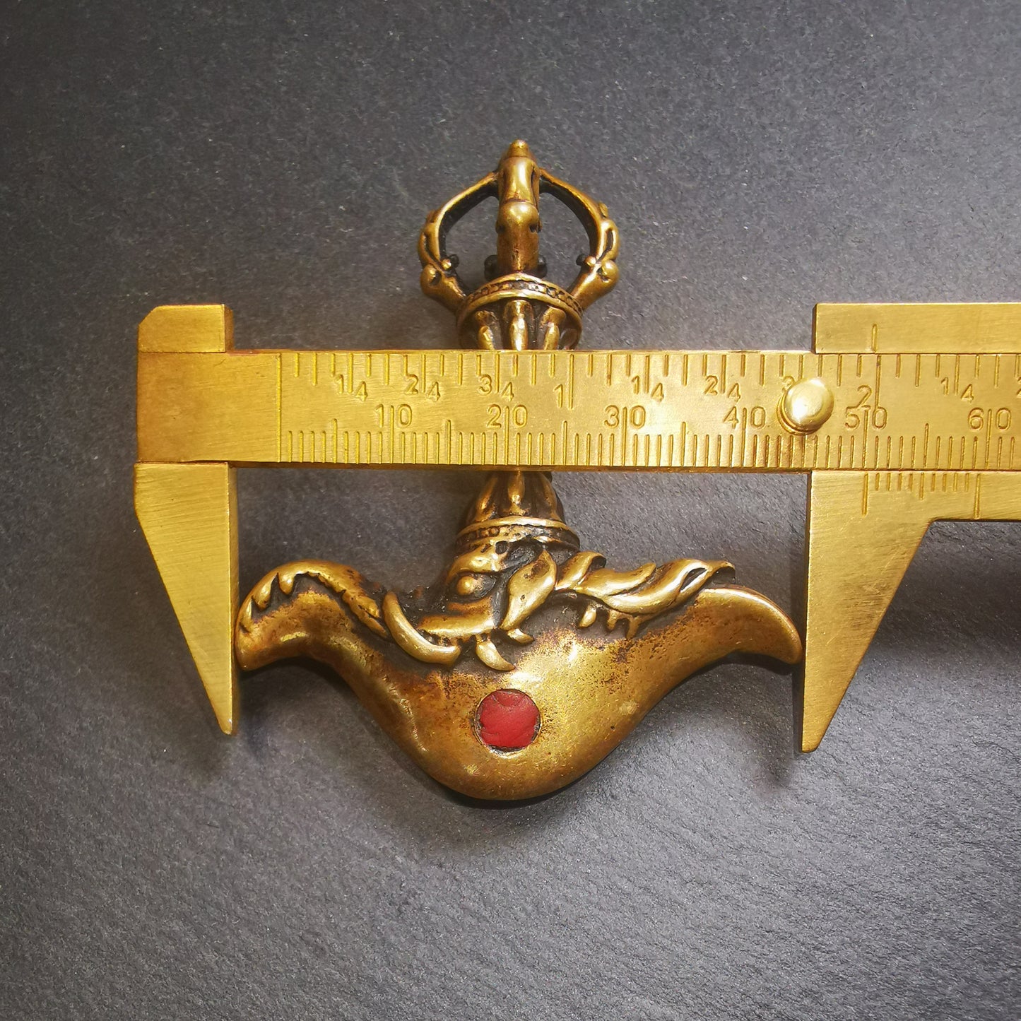 This kartika ritual was collected from Gengqing monastery,Derge Tibet,about 30 years. It's made of brass, inlaid agate,the upper part is a half vajra,and the size is 1.34 × 0.67 inches. You can put it in your shrine.