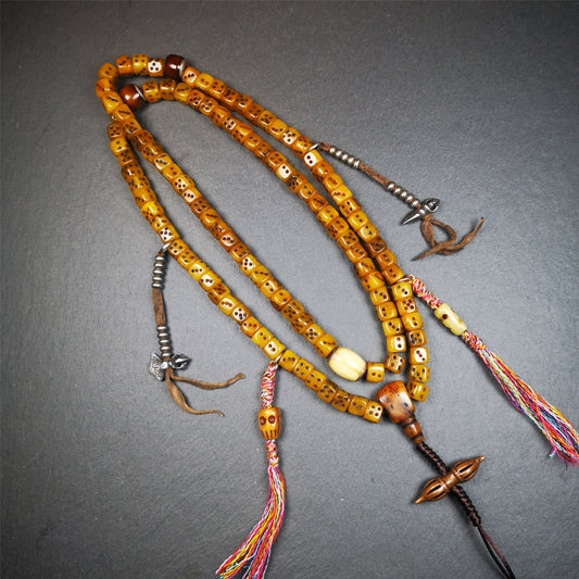 This unique mala was made by Tibetan craftsmen,blessed by lama. It is made of yak bone, yellow color,108 dice beads diameter of 8mm / 0.32",circumference is 84cm / 33",and lots of accessories on mala.