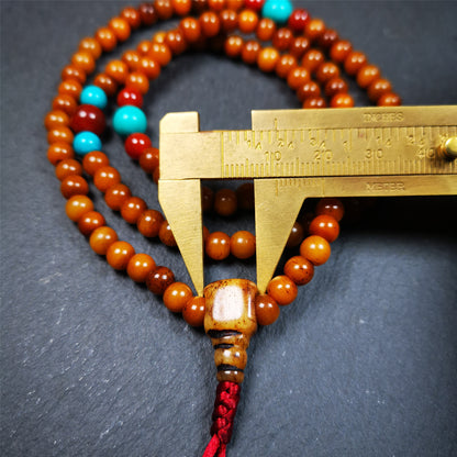 This yak bone mala was handmade from tibetan crafts man in Baiyu County,about 30 years old. It's composed of 108 pcs small size 6mm bone beads,with agate and turquoise beads,bone guru bead.Circumference about 61cm,24 inches.