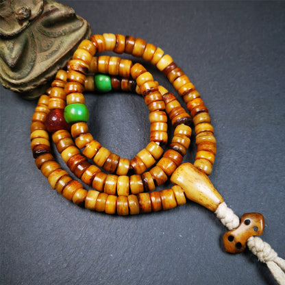 This yak bone mala was handmade from tibetan crafts man in Baiyu County,about 30 years old. It's composed of 108 pcs 9mm bone beads,with agate, turquoise,bone guru bead,and vajra pendant.