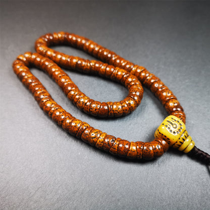 This lotus seed mala was collected from Baiyu county,about 40 years old,hold and blessed by a lama. It is composed of 108 bodhi seed beads, bevel cut shape,brown color,and 1 yak bone guru bead.