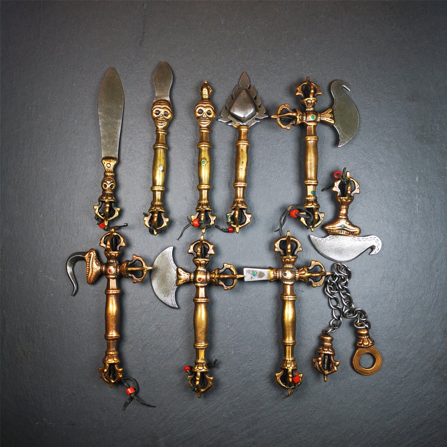 This set of Ritual Implements are handmade by Tibetan craftsmen from Tibet in 1980s,collected from derge parkhang monastery. They are made of copper,cold iron,total 10 pcs,include kila,kartika,hook,hammer,and other implements,please see the picture.