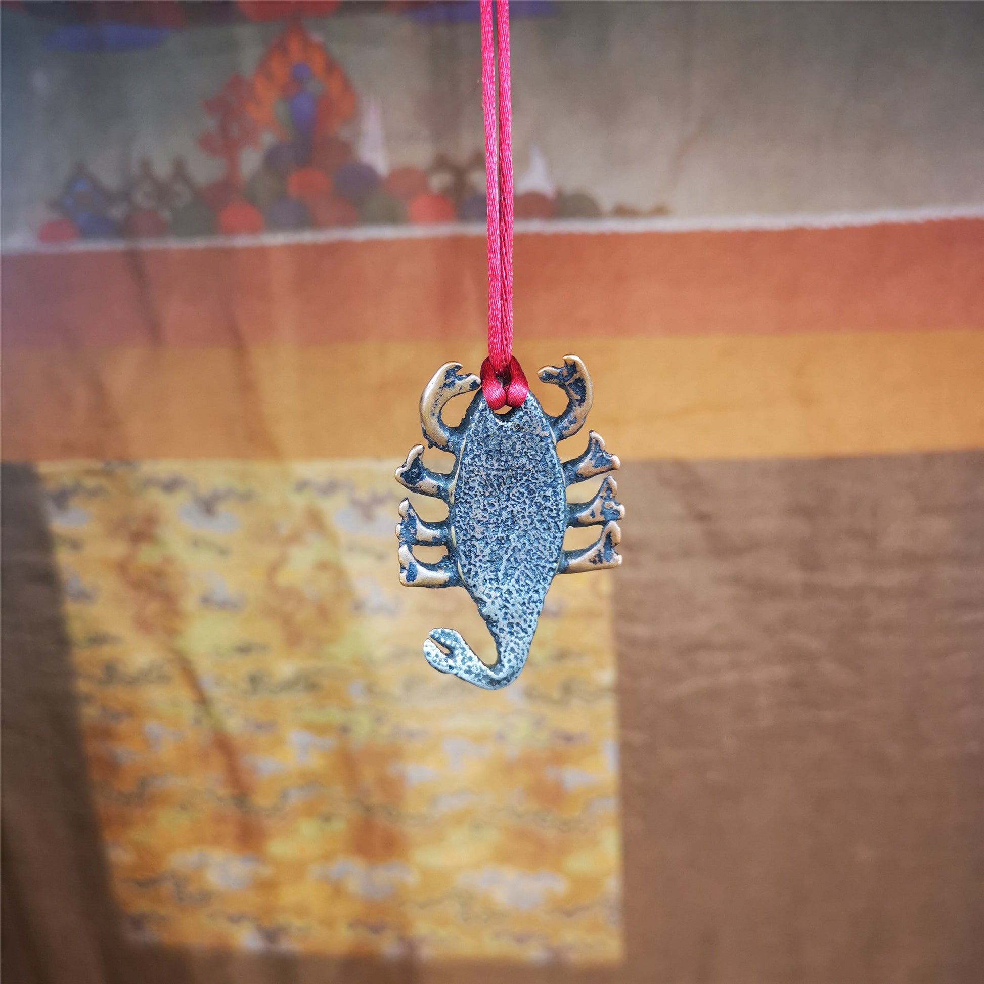 This scorpion amulet is made by Tibetan craftsmen in Hepo Township, Baiyu County, the birthplace of the famous Tibetan handicrafts. It is made of cold iron and copper,black color, size is 1.6 × 1.2 inches.The body is cold iron,and the legs are copper wire. You can make it into a necklace, or a keychain, or just put it in your shrine.