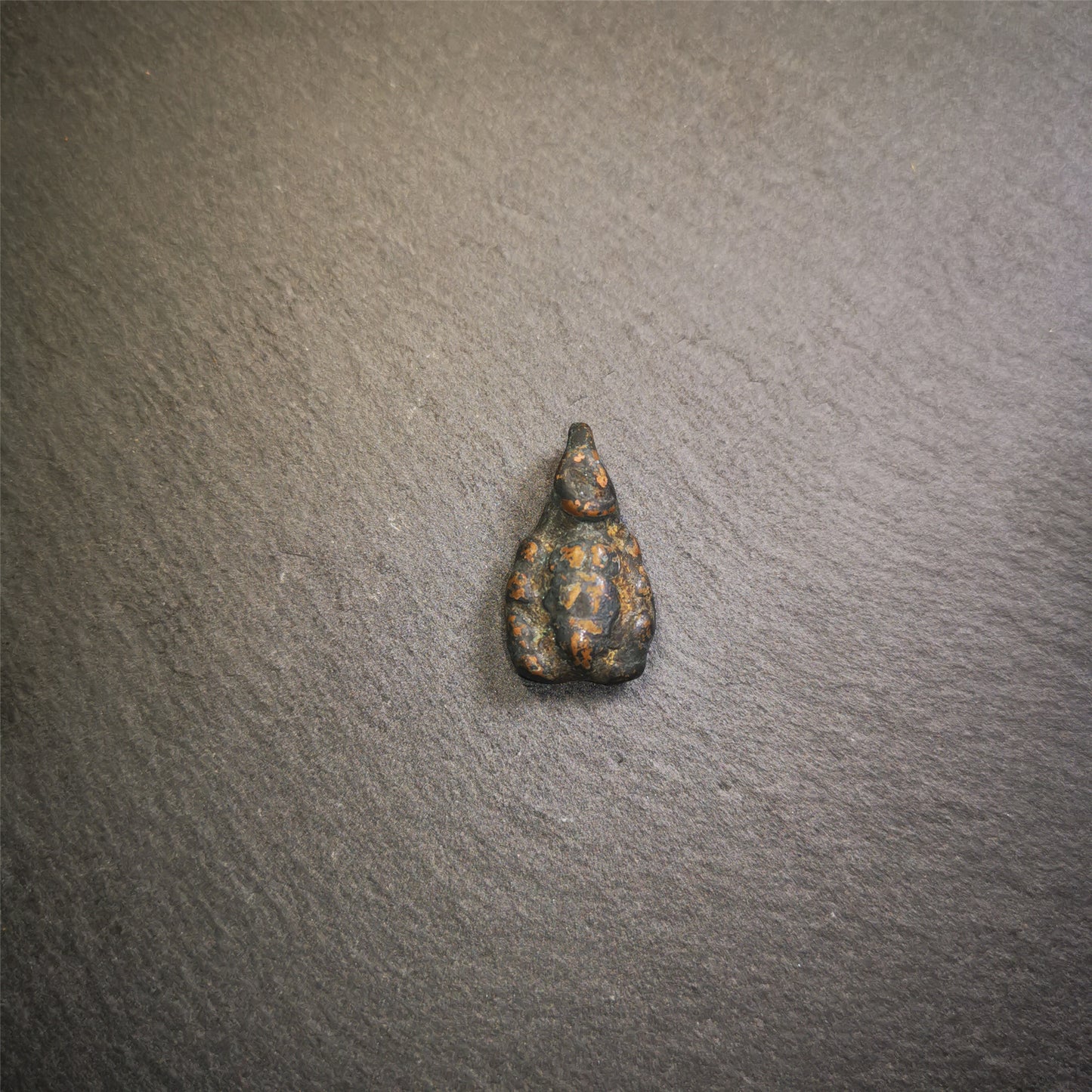 This scorpion amulet was collected from Derge County,Tibet,about 40 years old. It is made of copper, size is 0.95" × 0.55" inches. You can make it into a necklace, or a keychain, or just put it in your shrine.
