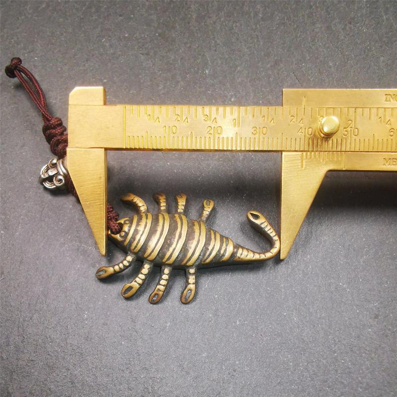 This scorpion amulet is collect from Baiyu Tibet,it is made of brass,yellow color,size is 1.57 inch. You can make it into a necklace pendant, bag hanging,keychain, or just put it on your desk,as an ornament.