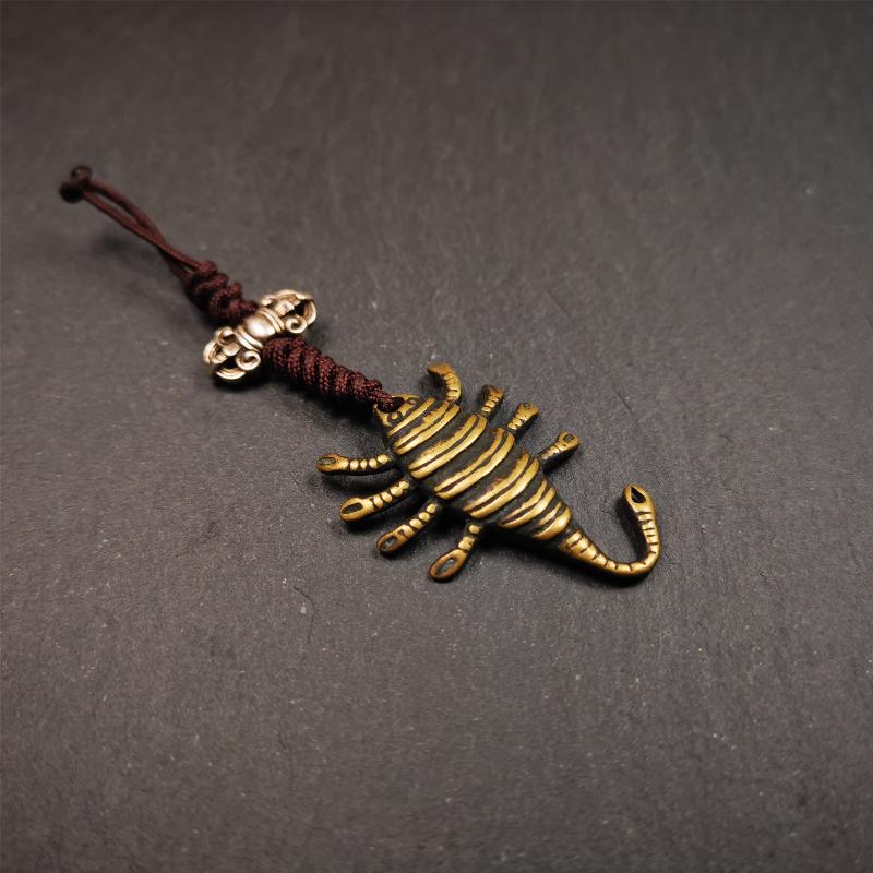 This scorpion amulet is collect from Baiyu Tibet,it is made of brass,yellow color,size is 1.57 inch. You can make it into a necklace pendant, bag hanging,keychain, or just put it on your desk,as an ornament.