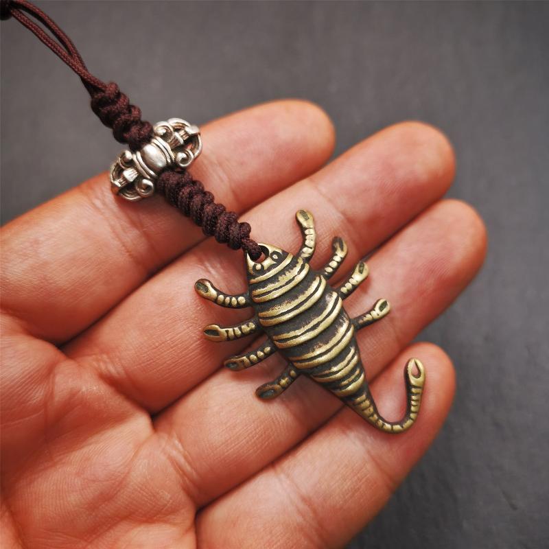 This scorpion amulet is collect from Baiyu Tibet,it is made of brass,yellow color,size is 1.57 inch. You can make it into a necklace pendant, bag hanging,keychain, or just put it on your desk,as an ornament.