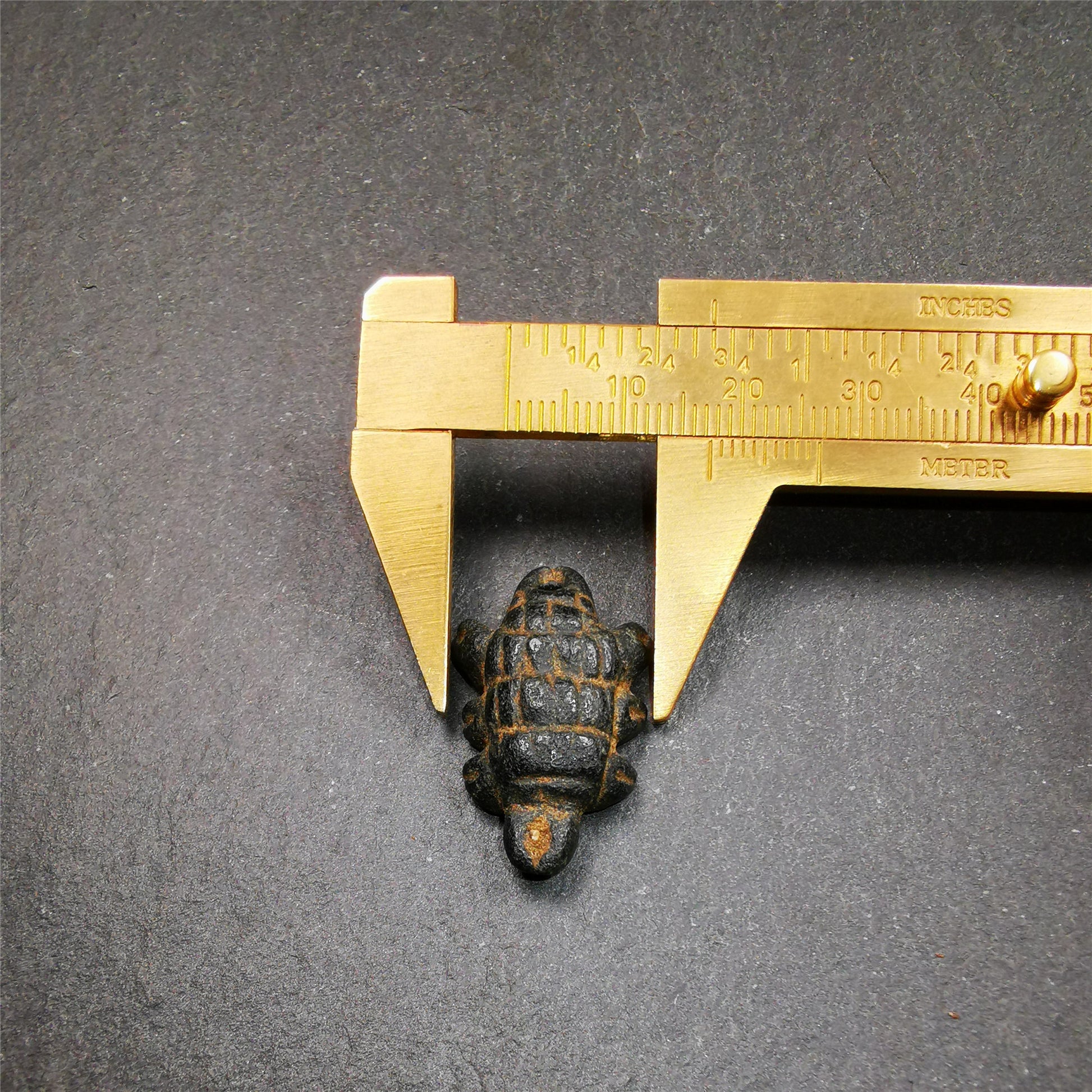 This unique obsidian carved Scorpion Guru pendant is made by Tibetan craftsmen in Hepo Township, Baiyu County, the birthplace of the famous Tibetan handicrafts. It's made of obsidian,black color,1.1 inch height. You can make it into necklace,or mala pendant.