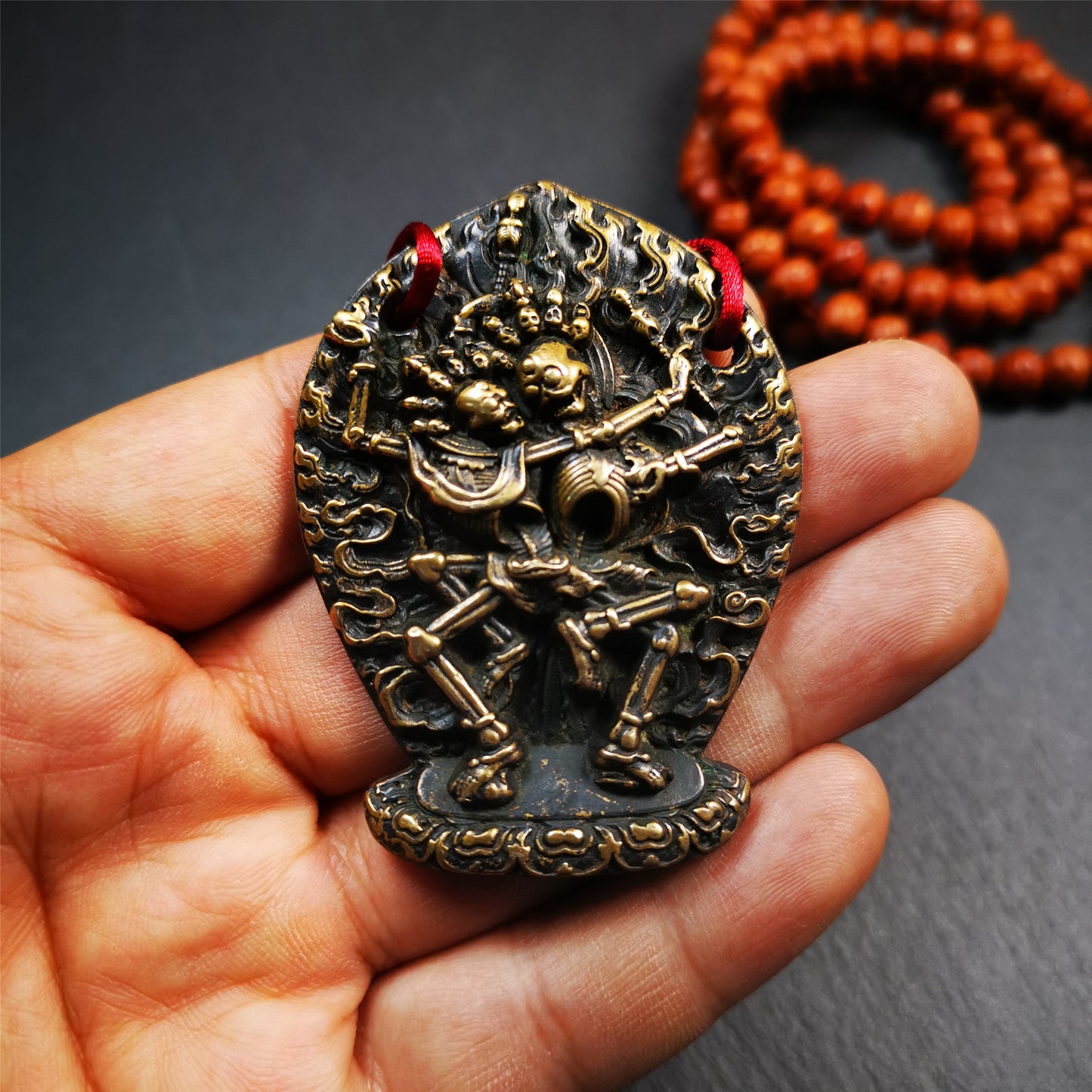 This beautiful Skull Masters of Sitavana statue was collected from Gerze Tibet. It is Masters of Sitavana,the corpse forest owner and his wife stand hugging and standing on the seat cushion. It's made of brass,yellow color,size is 2.1 × 1.8 inches.