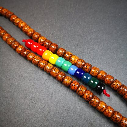 The price is 1 pair of 2 Strings Sherpa Glaze Beads,total 24 beads.(each string 12 beads)  These marker beads were handmade by Tibetan craftsmen and come from Hepo Town, Baiyu County, the birthplace of the famous Tibetan handicrafts. It is made of sherpa glaze,rainbow color,size is 0.31" × 0.24". Fit for 6-8mm mala (The reference in the photo is 8mm lotus seed mala)