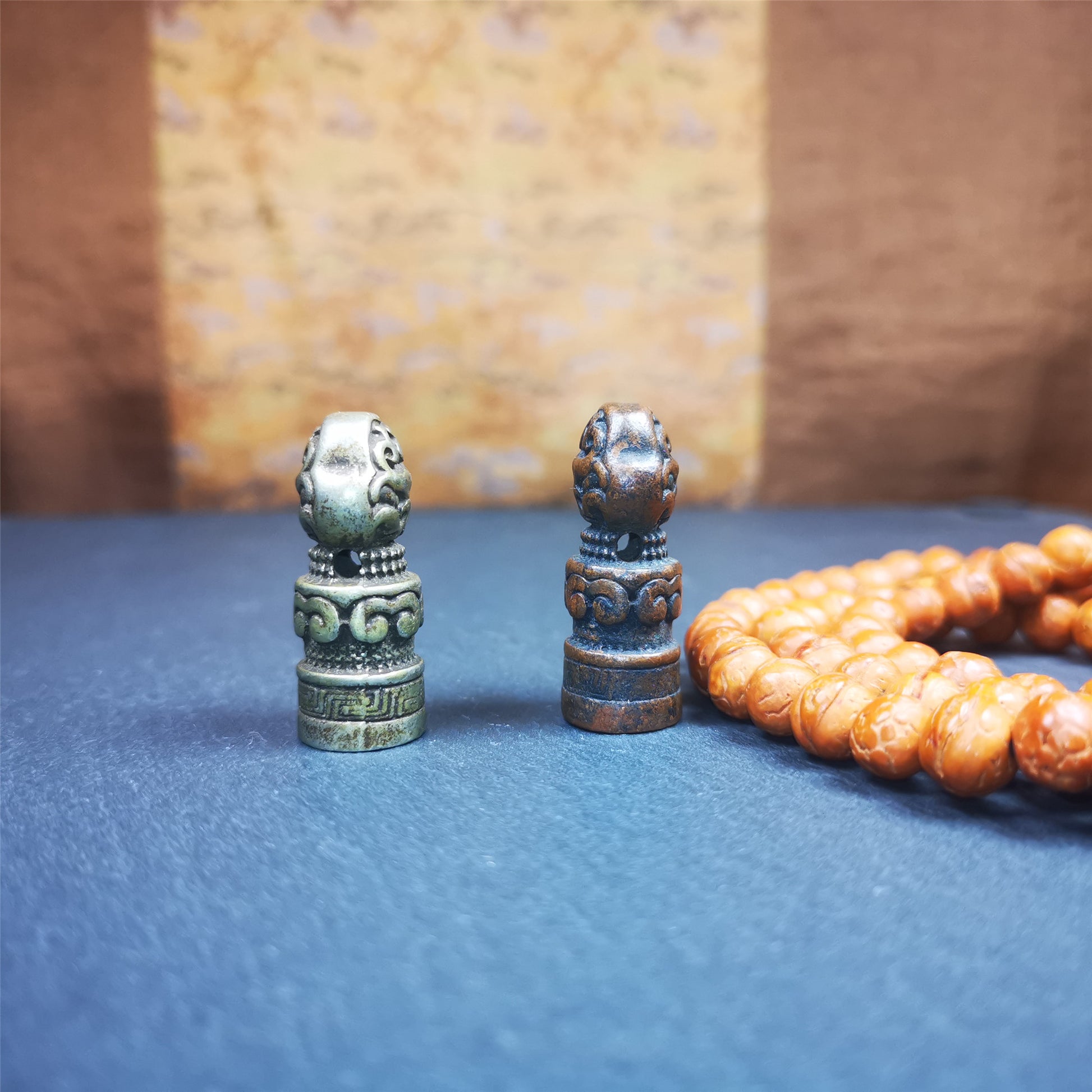 These vintage stamps were handmade from tibet,about 40 years old. They're made of copper/brass,carved snow lion and lucky cloud pattern on the body,the Naga symbol seal on the bottom,means good luck and bless. The symbol of the seal is Naga God, snake or dragon in Hinduism and Buddhism,also looks like the OM symbol. You can make it into a necklace or keyring pendant, or just place it on your desk as a decoration.