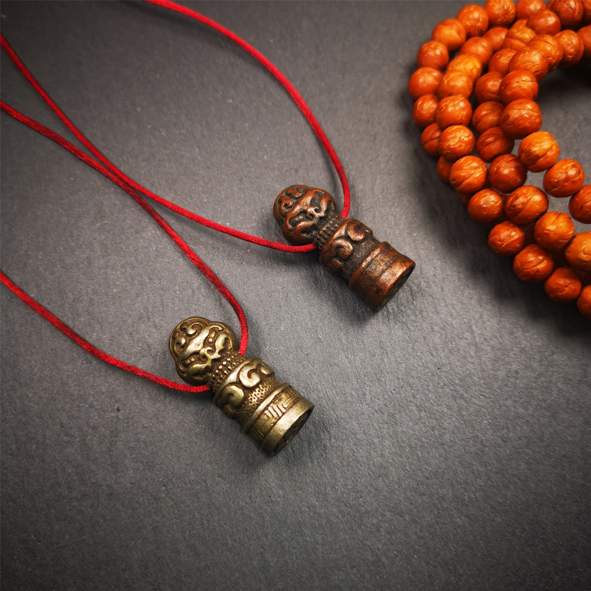 These vintage stamps were handmade from tibet,about 40 years old. They're made of copper/brass,carved snow lion and lucky cloud pattern on the body,the Naga symbol seal on the bottom,means good luck and bless. The symbol of the seal is Naga God, snake or dragon in Hinduism and Buddhism,also looks like the OM symbol. You can make it into a necklace or keyring pendant, or just place it on your desk as a decoration.