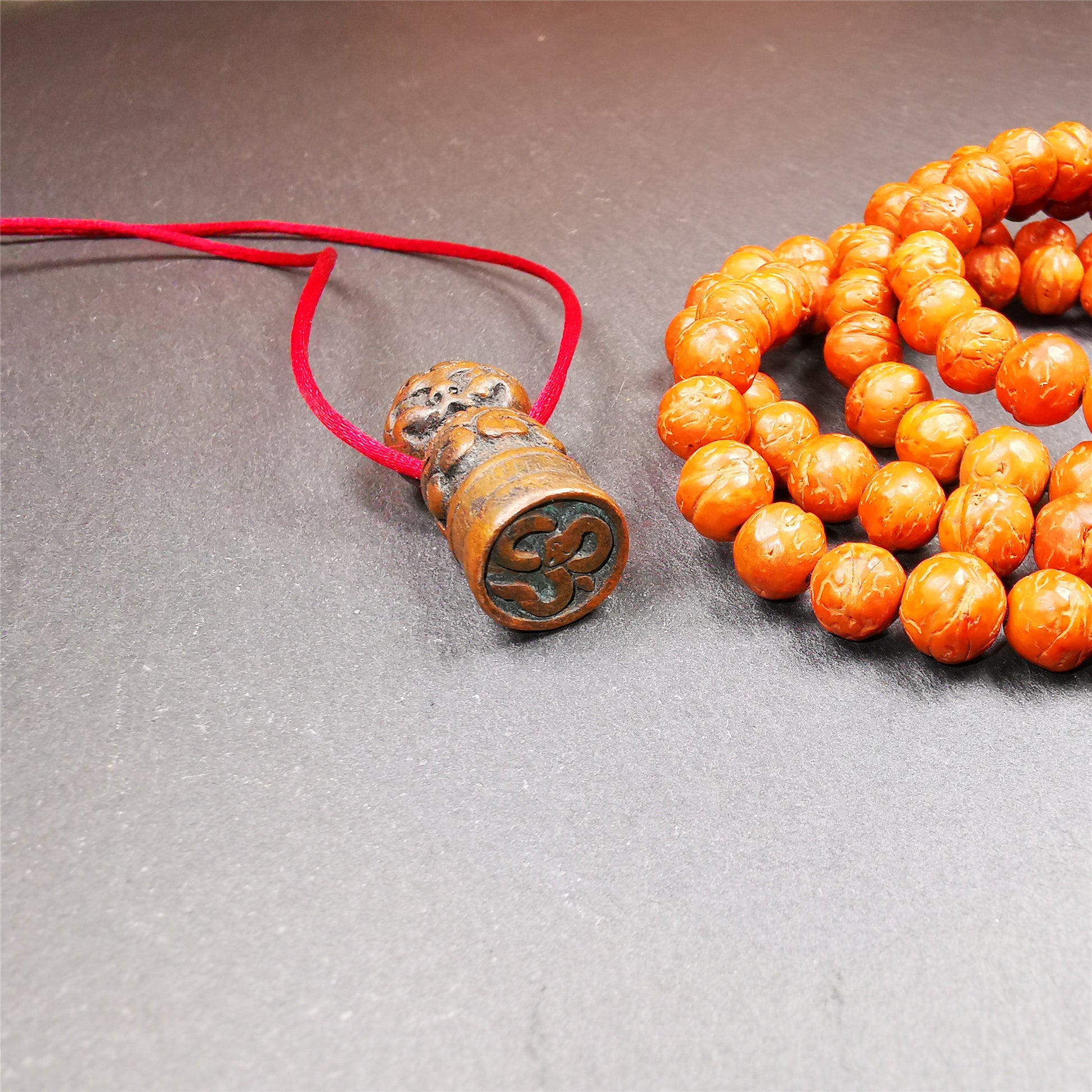 These vintage stamps were handmade from tibet,about 40 years old. They're made of copper/brass,carved snow lion and lucky cloud pattern on the body,the Naga symbol seal on the bottom,means good luck and bless. The symbol of the seal is Naga God, snake or dragon in Hinduism and Buddhism,also looks like the OM symbol. You can make it into a necklace or keyring pendant, or just place it on your desk as a decoration.