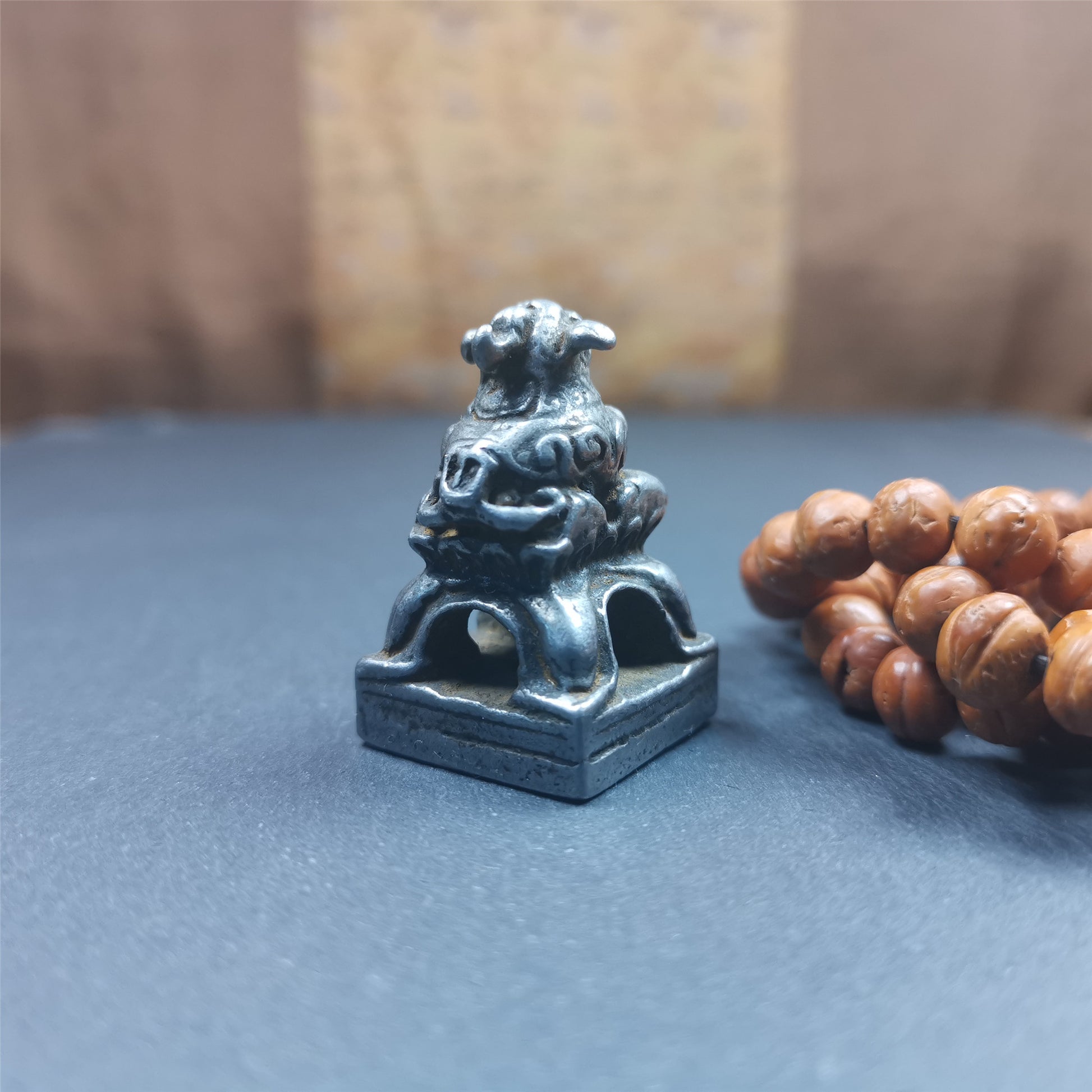 This antique seal was collected from Derge,Tibet,about 30 years old. It is made of cold iron,carved Snow Lion Shape, and  Stupa symbol seal on the bottom,size is 1.38 inches.