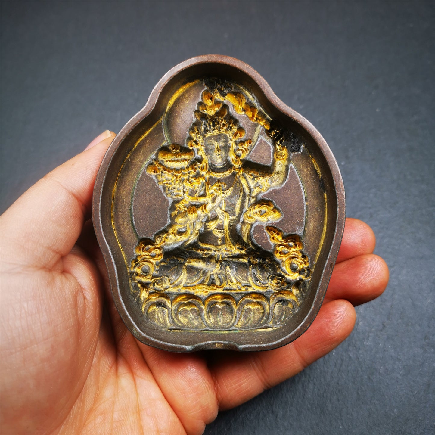 This unique Manjusri Tsa-Tsa buddha statue mold is made by Tibetan craftsmen in Hepo Township, Baiyu County. With this exquisite mold, you can use clay to make your own Buddha statue as a decoration or consecration. The statue that you make from your moulds can be left plain or painted.