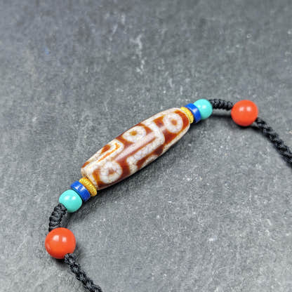 Fire Agate 9 Eye Dzi Bead Necklace - Tibetan Buddhist bead necklace, close-up detail