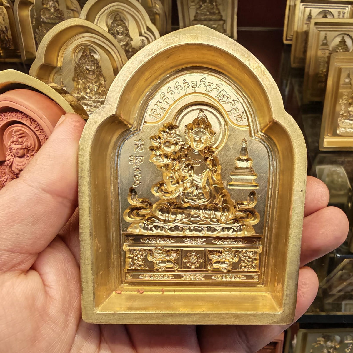 Bordered White Tara Tsa Tsa Mold - Tibetan tsa tsa mold, detailed view