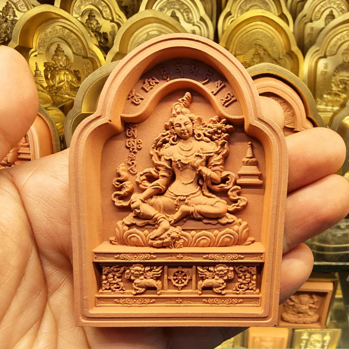 Bordered Yellow Tara Tsa Tsa Mold - Tibetan tsa tsa mold, close-up detail