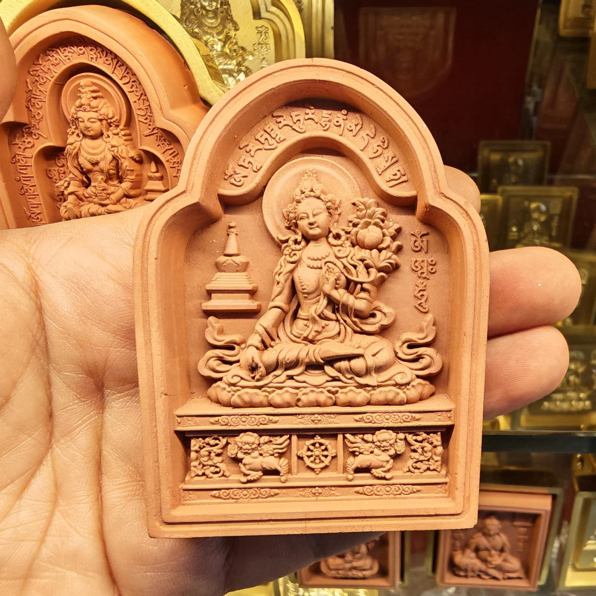 Bordered White Tara Tsa Tsa Mold - Tibetan tsa tsa mold, close-up detail