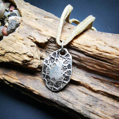 Protective Pendant,Om Mani Padme Hum Mantra Amulet - Tibetan Buddhist amulet, close-up detail