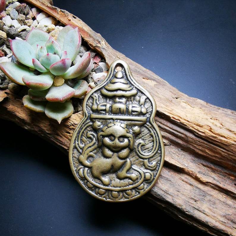 Buddhist Protective Pendant,Snow Lion Amulet Badge - Tibetan Buddhist amulet, close-up detail