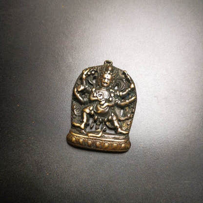 Thokcha Amulet Pendant,Mahakala, Buddhist Protector Deity, Made of Thunder Iron - Tibetan Buddhist amulet, close-up detail
