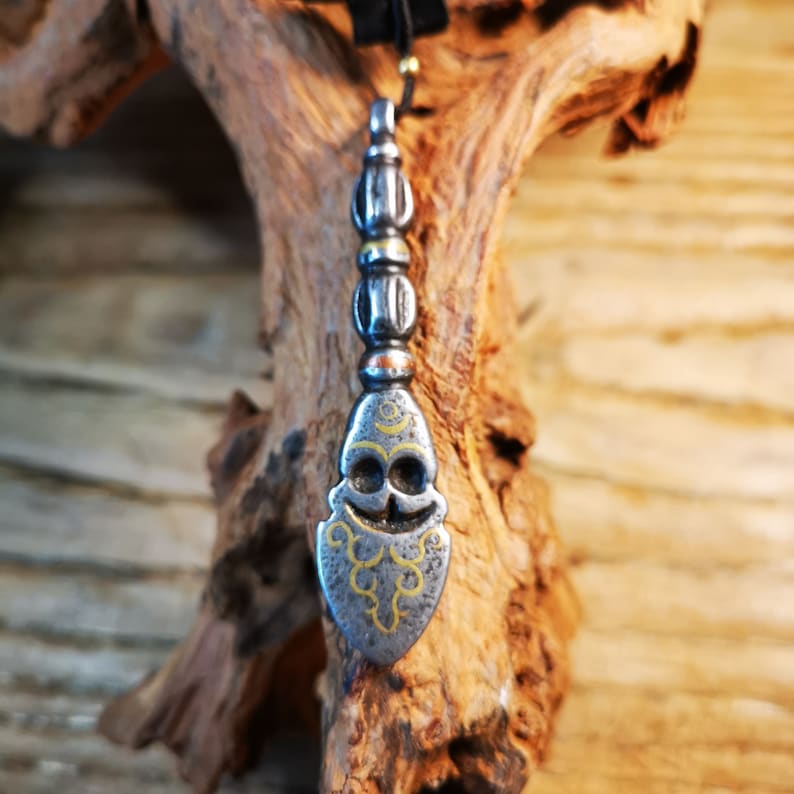 Amulet,Skull Sītavana and Flame Pendant